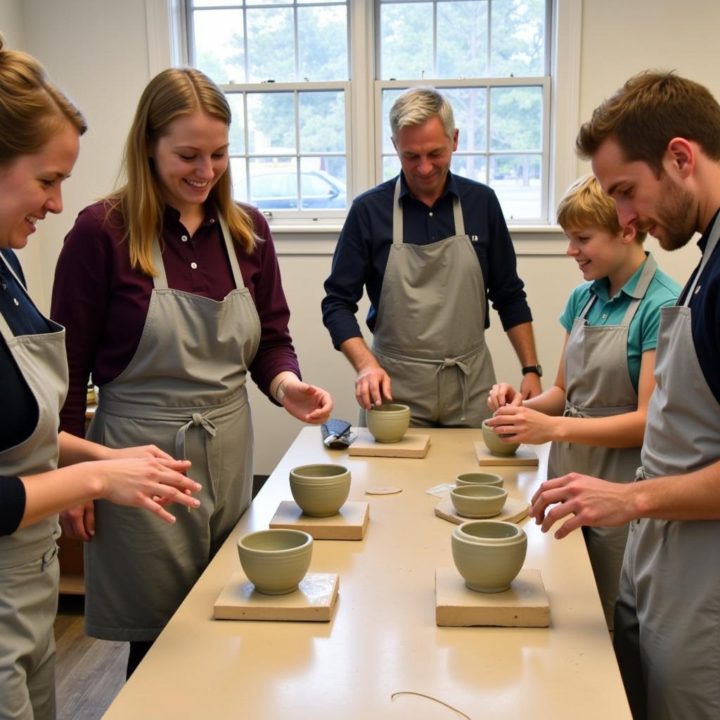 People participating in a pottery workshop in Falmouth MA