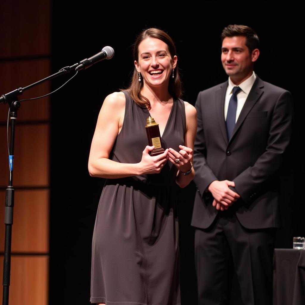 Betsy Schneider Receiving an Award at an Art Ceremony