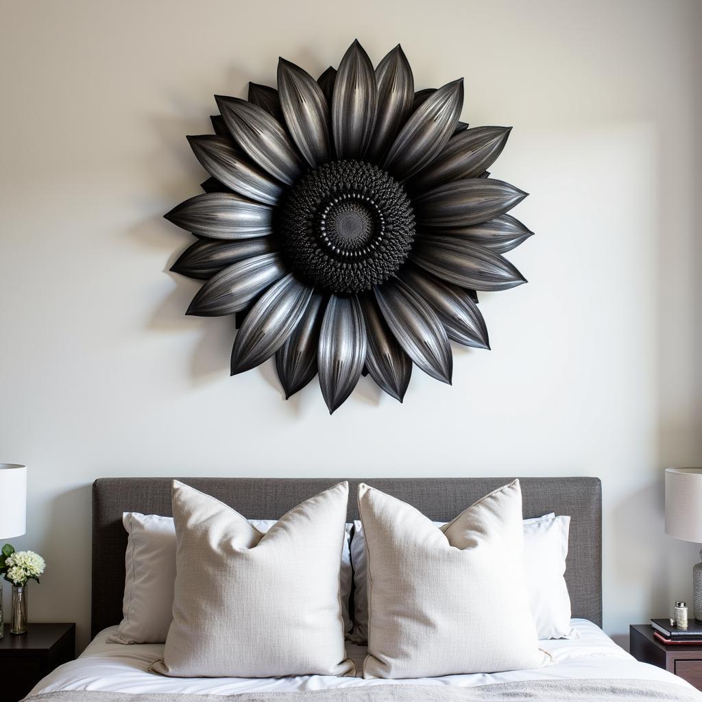 A black and white sunflower metal wall art piece creates a striking focal point above a bed