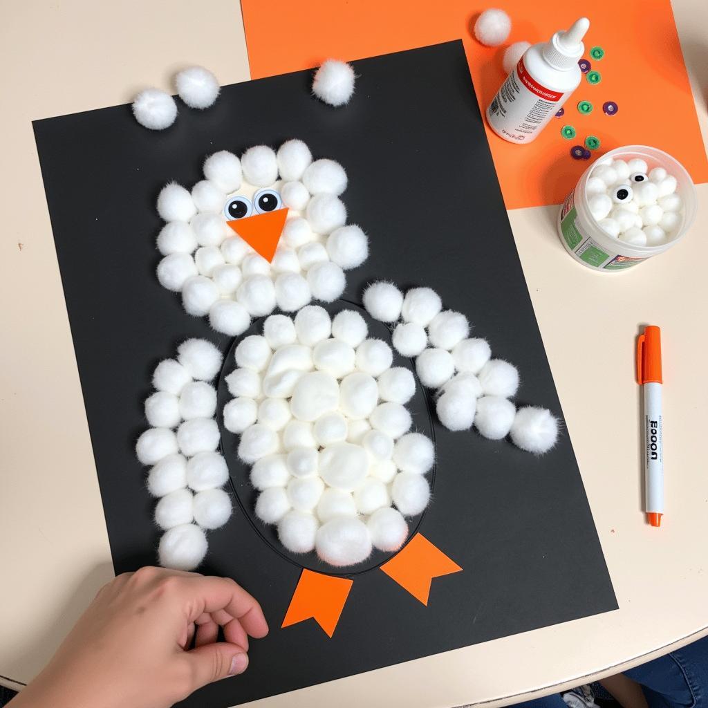 Cotton ball penguin craft for preschoolers