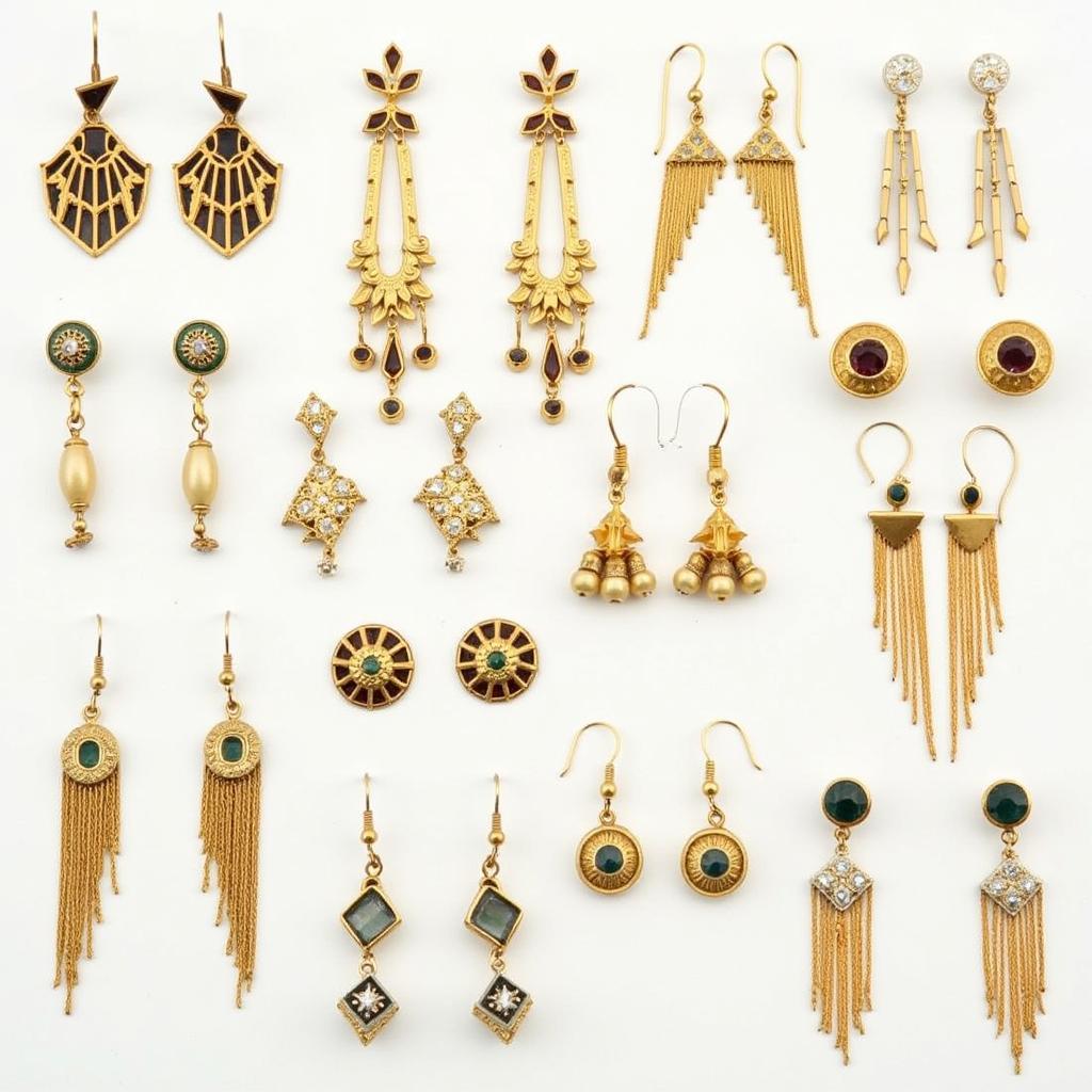 Various styles of art deco gold earrings on display