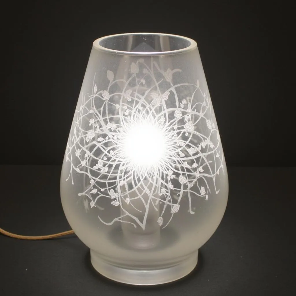 Etched glass table lamps, where light and shadow dance