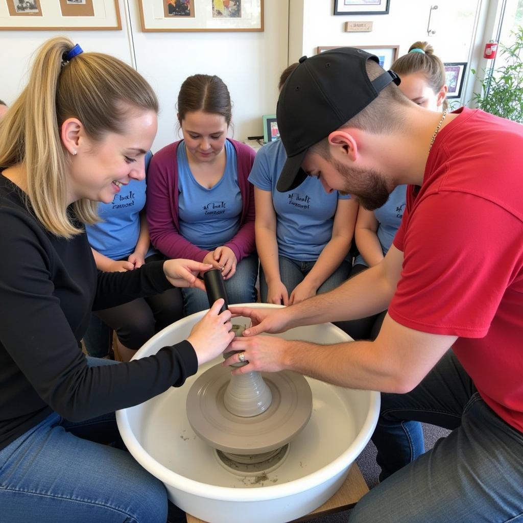 Artist demonstrating pottery techniques at the Henderson KY Arts and Crafts Festival