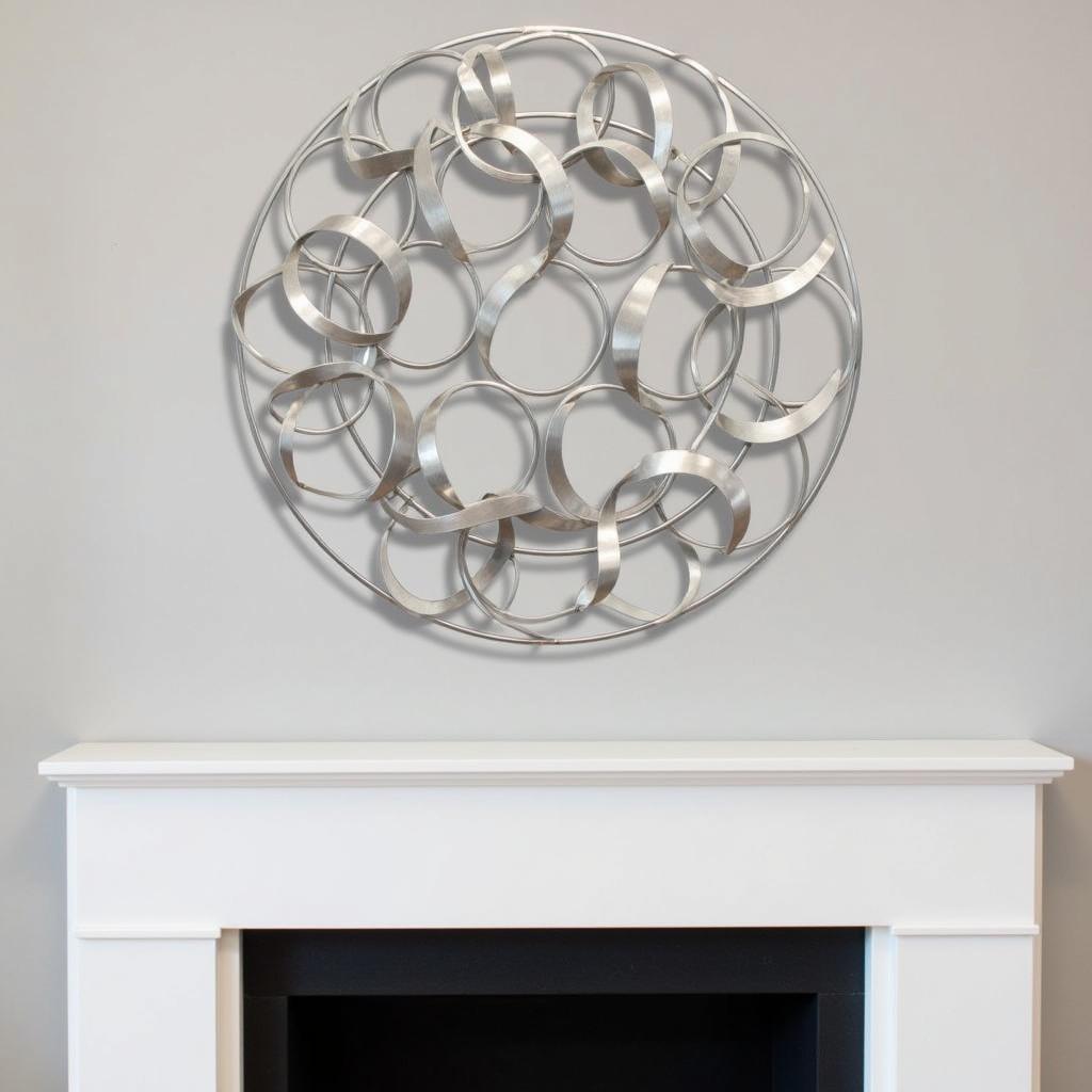 Silver metal wall art displayed above a fireplace