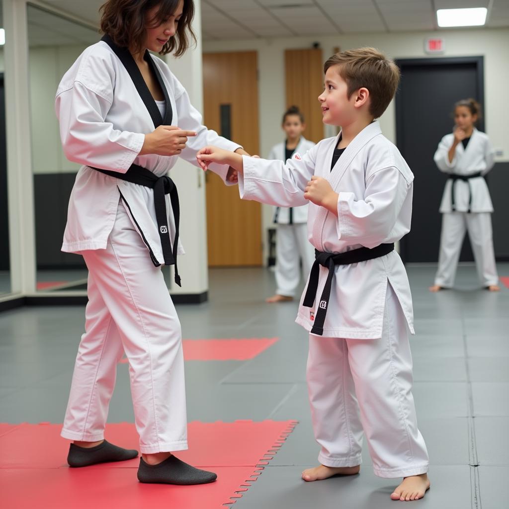 A three-year-old child practicing karate with a patient instructor