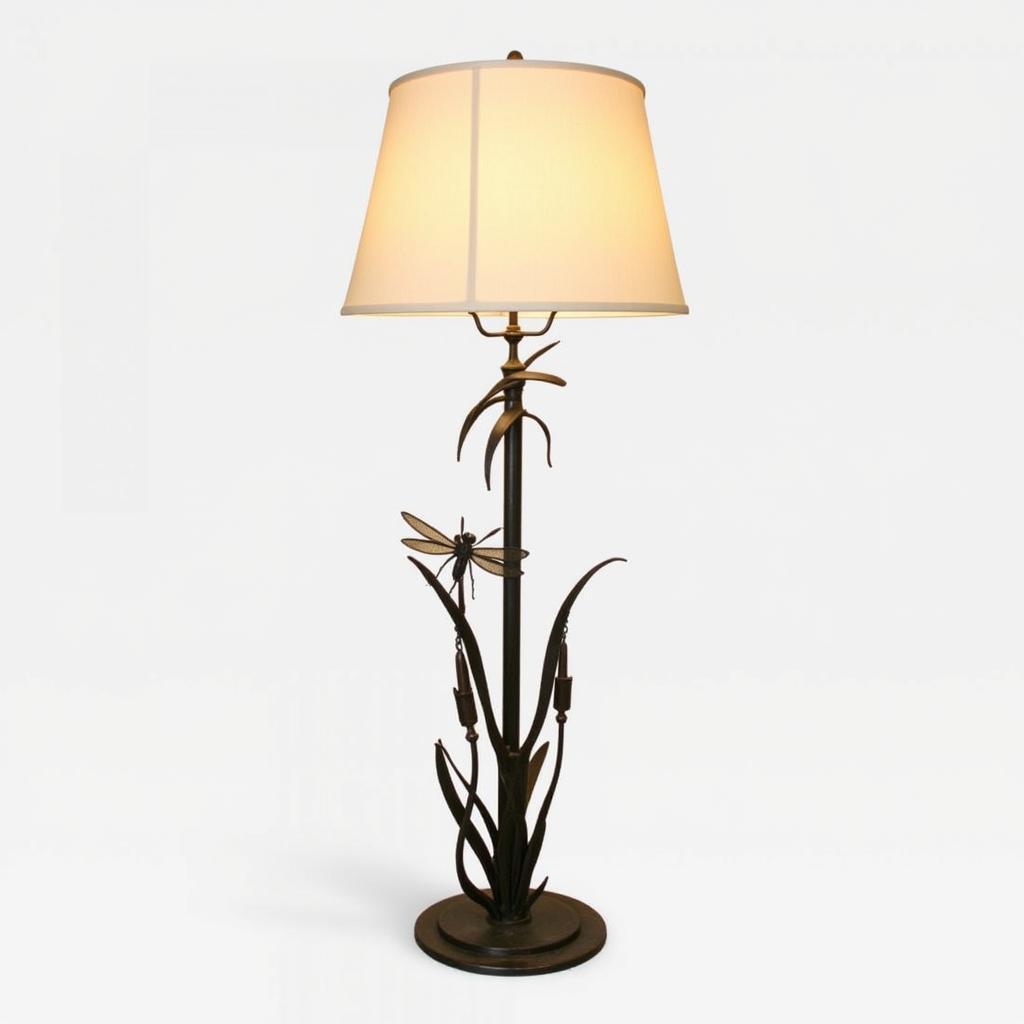 An art nouveau floor lamp with a wrought iron base and a dragonfly design.