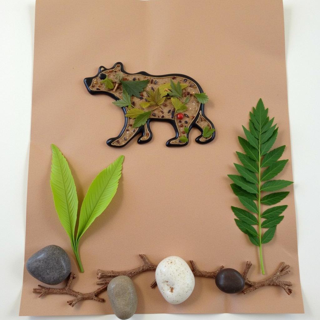 Bear art project incorporating natural materials like leaves and twigs