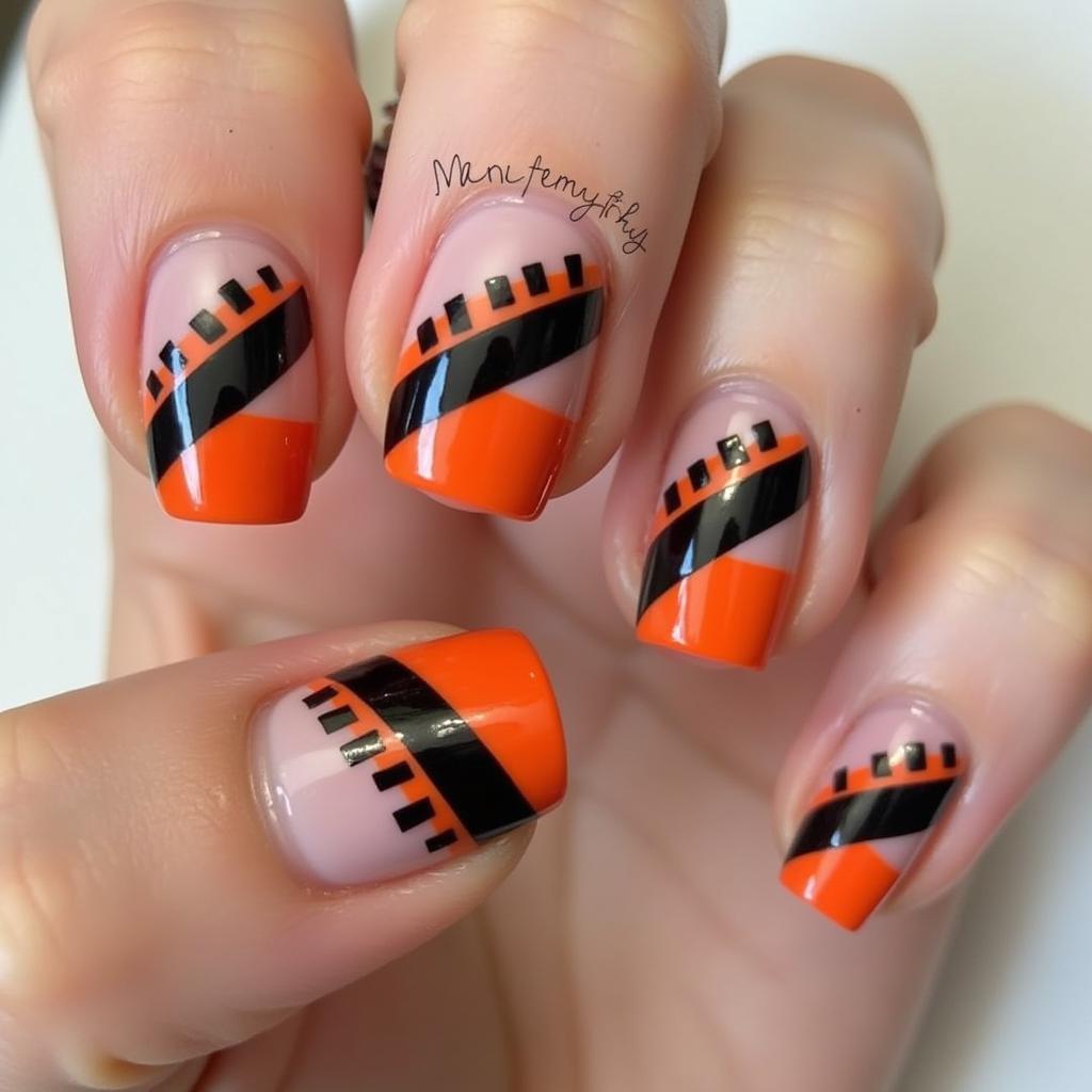 Black and Orange Geometric Nails