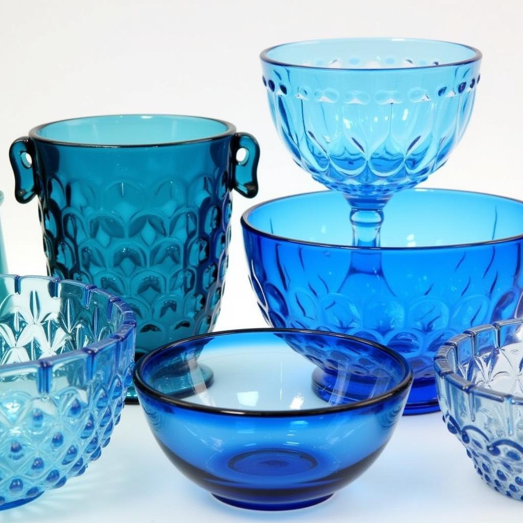 A Collection of Blue Art Glass Bowls in Various Styles