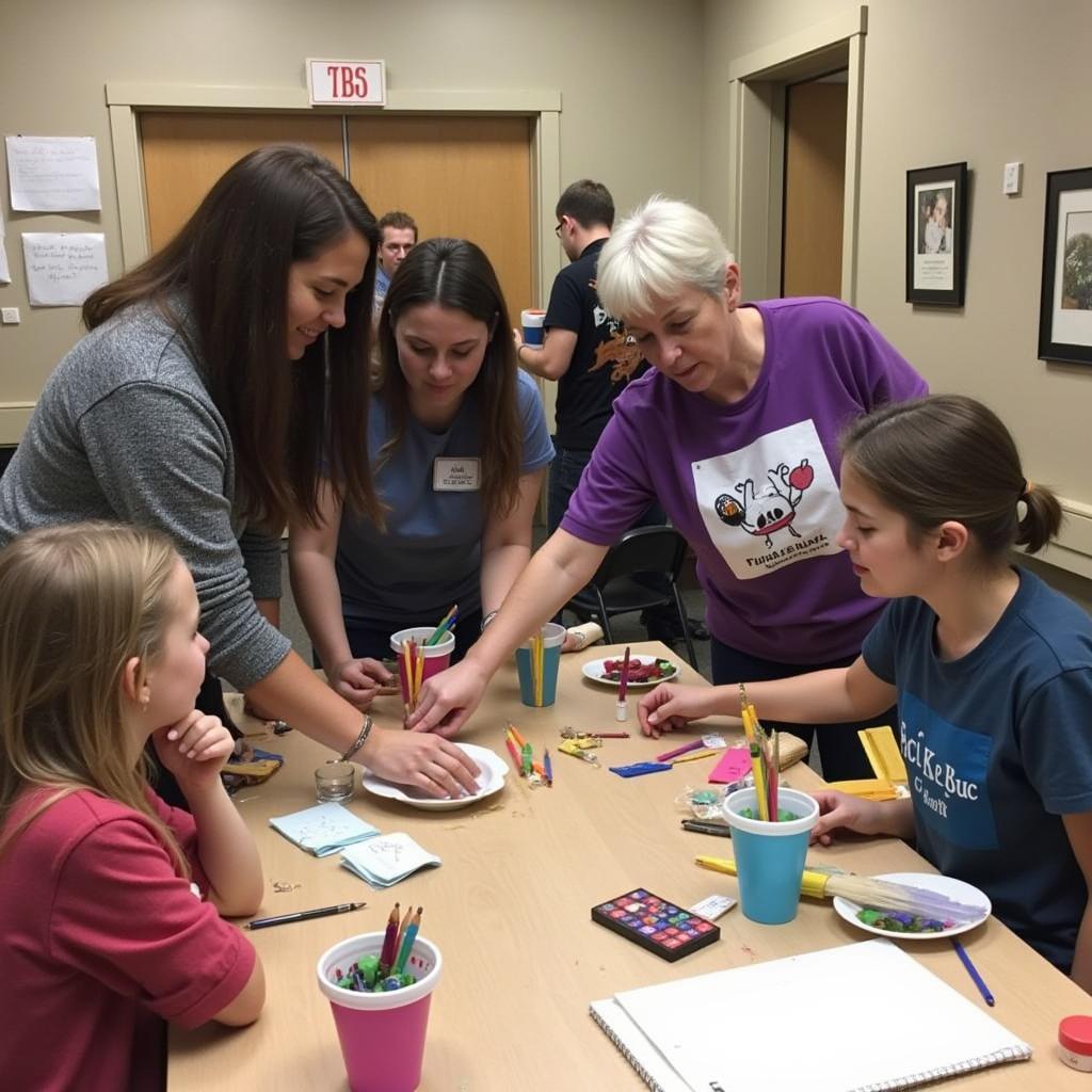 Volunteers Assisting in a Firefly Arts Workshop