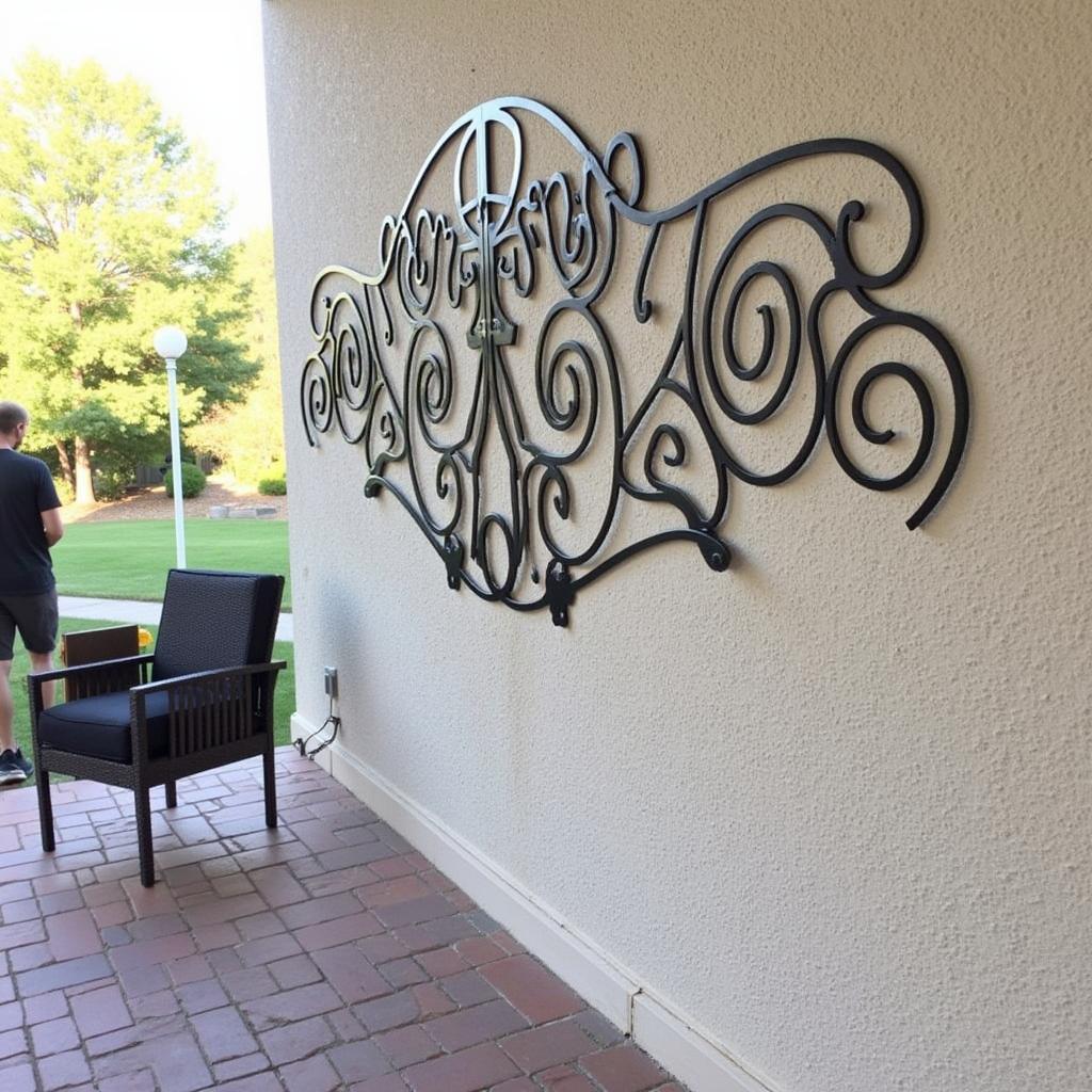 Metal Wall Art Installation on a Patio