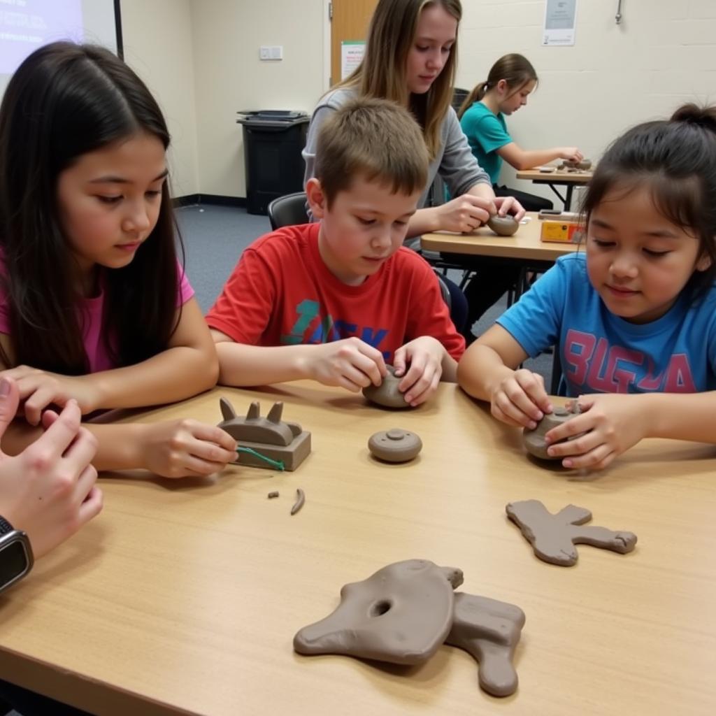 Middle school students working on clay sculpture projects