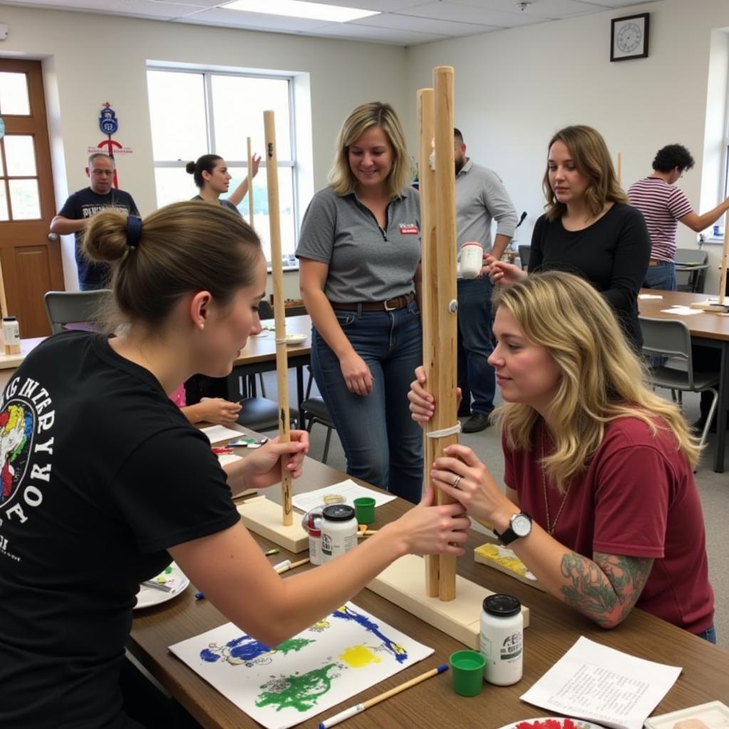 Participants in a peace art pole workshop learning to paint and create