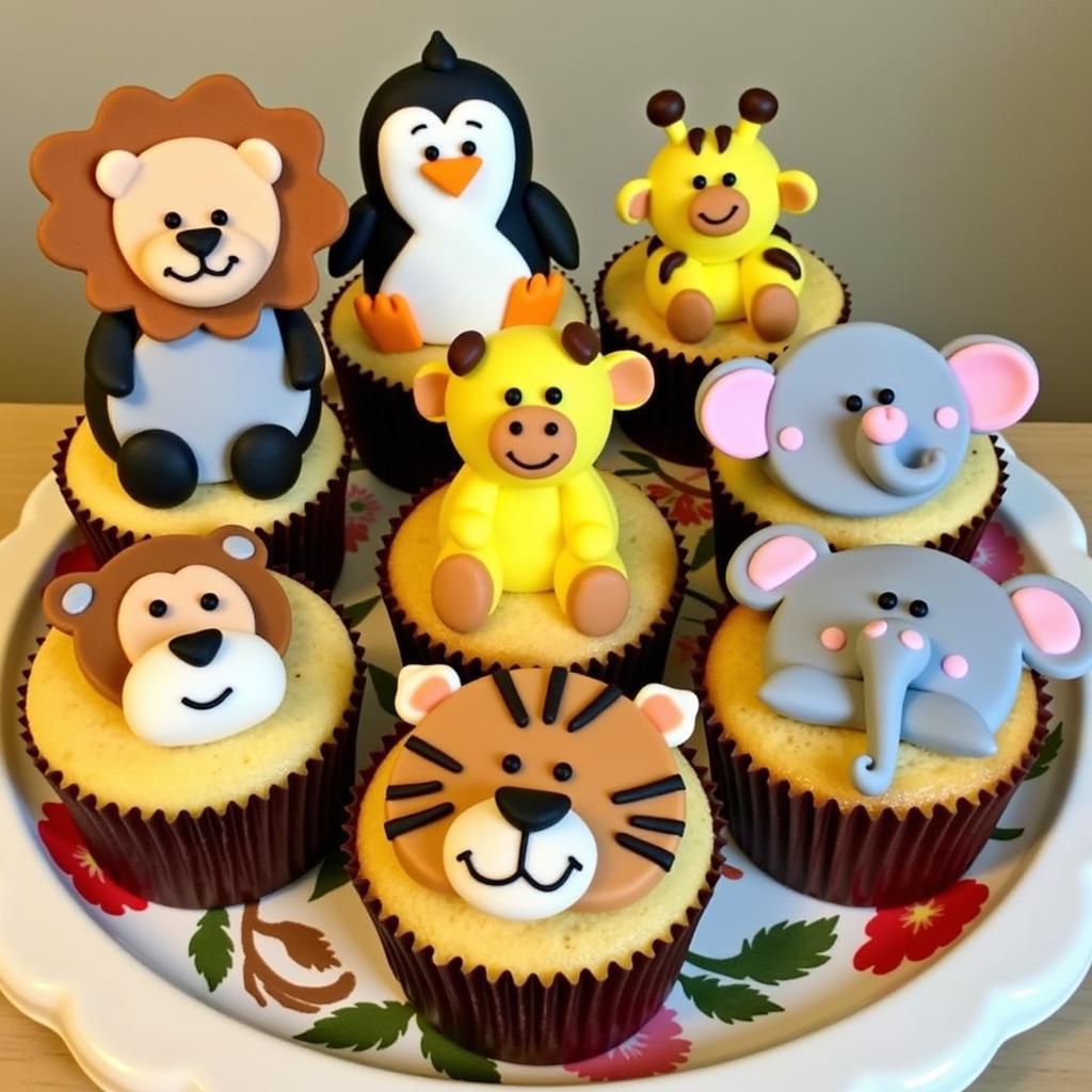 A Colorful Display of Various Zoo Animal Cupcakes