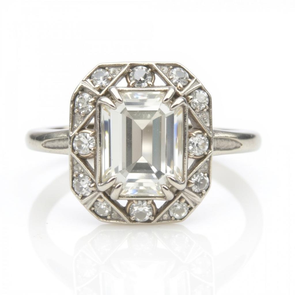 Vintage Art Deco engagement ring with an emerald cut diamond and filigree detailing