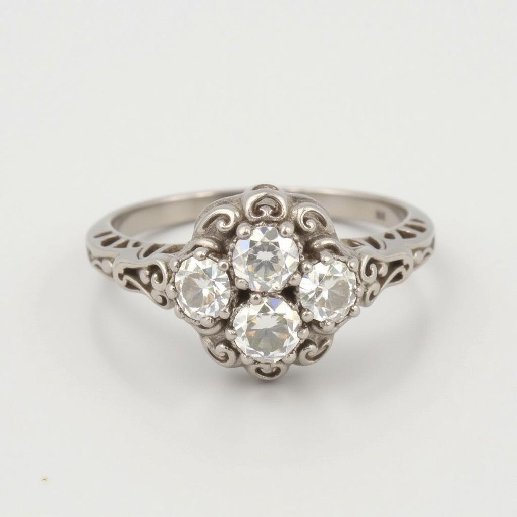 Vintage Art Deco Three-Stone Diamond Ring with Filigree Details