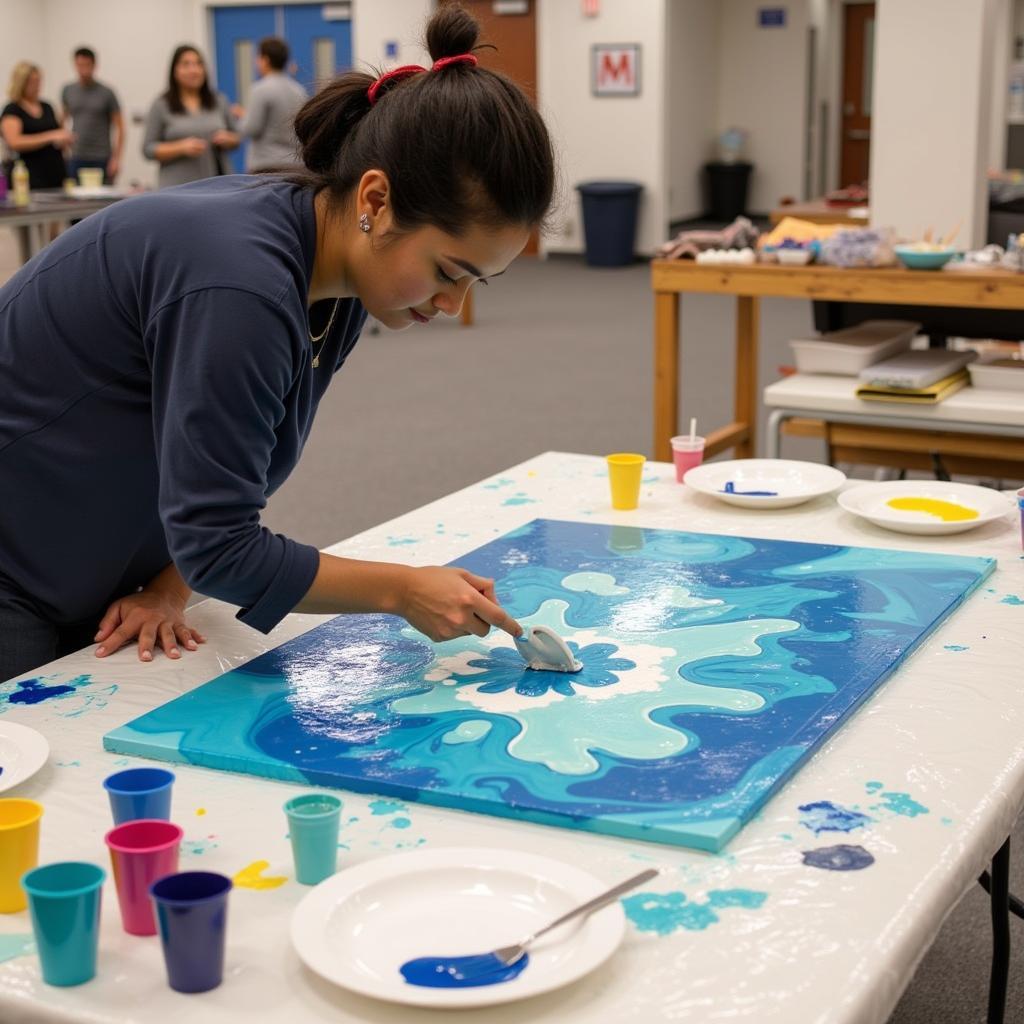 Adult Artist Using Activity Art Table for Fluid Art