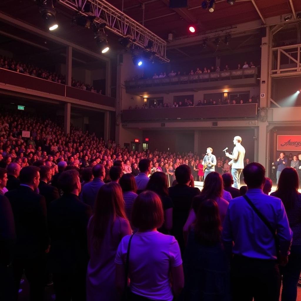 An enthusiastic audience enjoying a performance at the Armory.