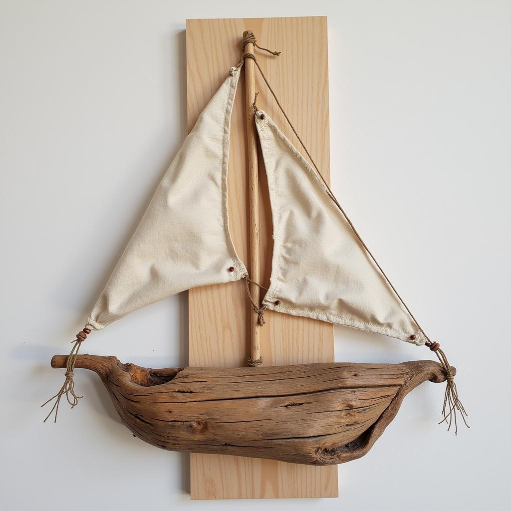 DIY pirate ship wall art created from driftwood and old sailcloth.