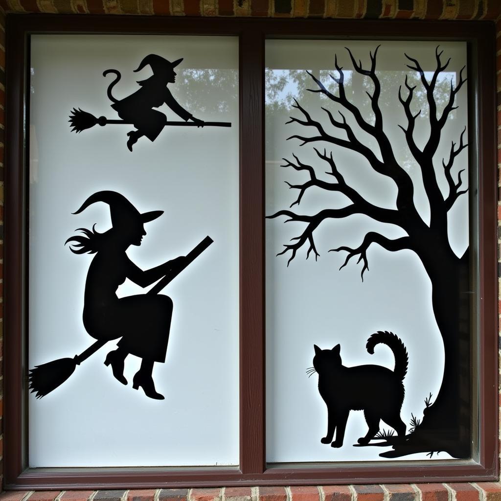 Spooky window decorations created with Halloween stencils.