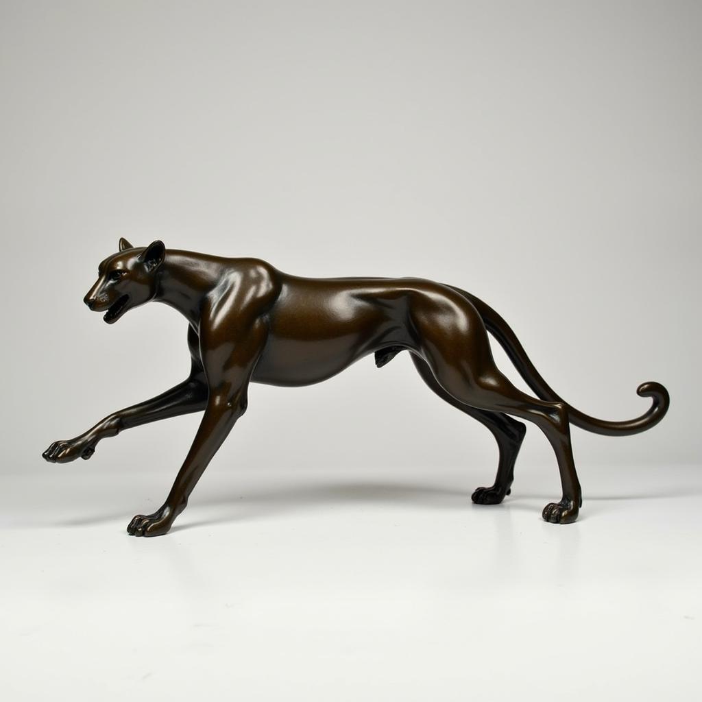 Bronze sculpture of a cheetah in motion