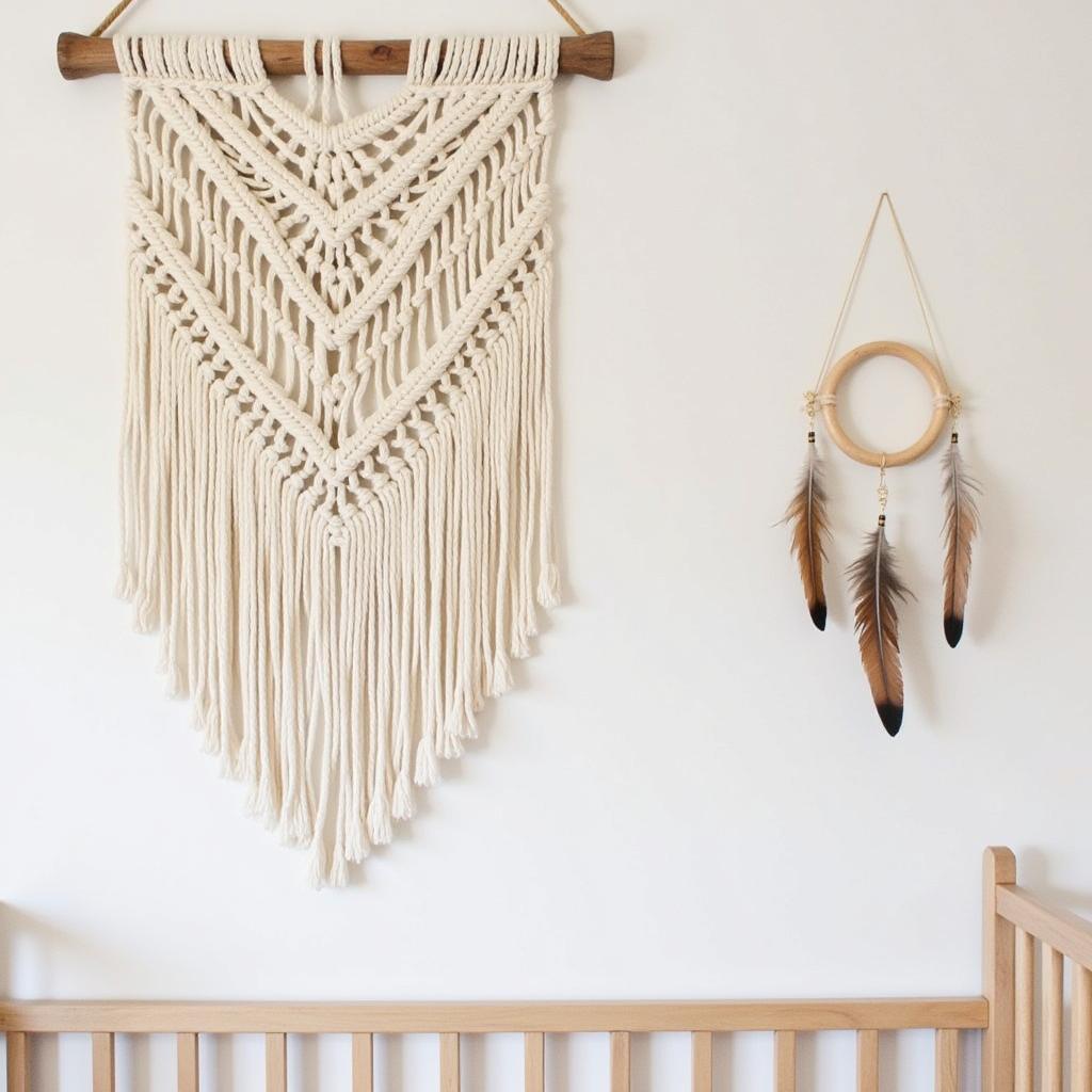 Boho nursery wall art featuring macrame wall hanging and feather mobile